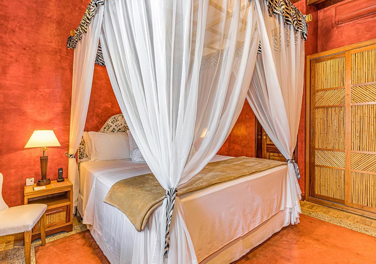 Dpny海滩水疗酒店 伊利亚贝拉 外观 照片 A bed with a mosquito net