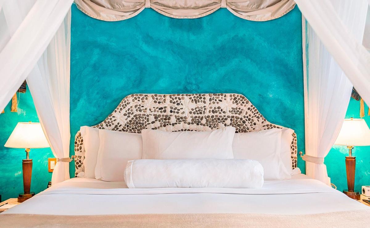 Dpny海滩水疗酒店 伊利亚贝拉 外观 照片 A bed with a headboard